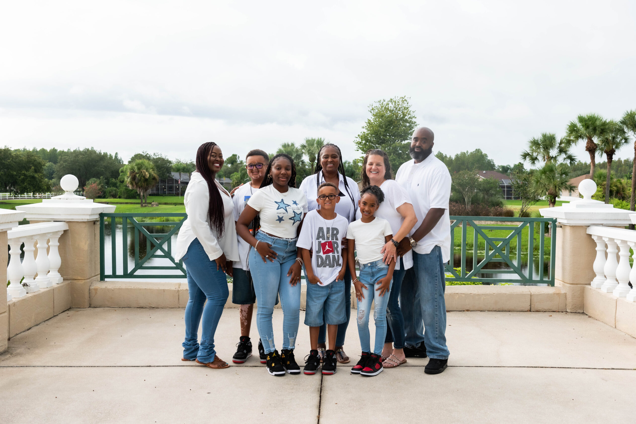 Large family portrait session outdoors in Tampa by Kimberley Asante Photography.